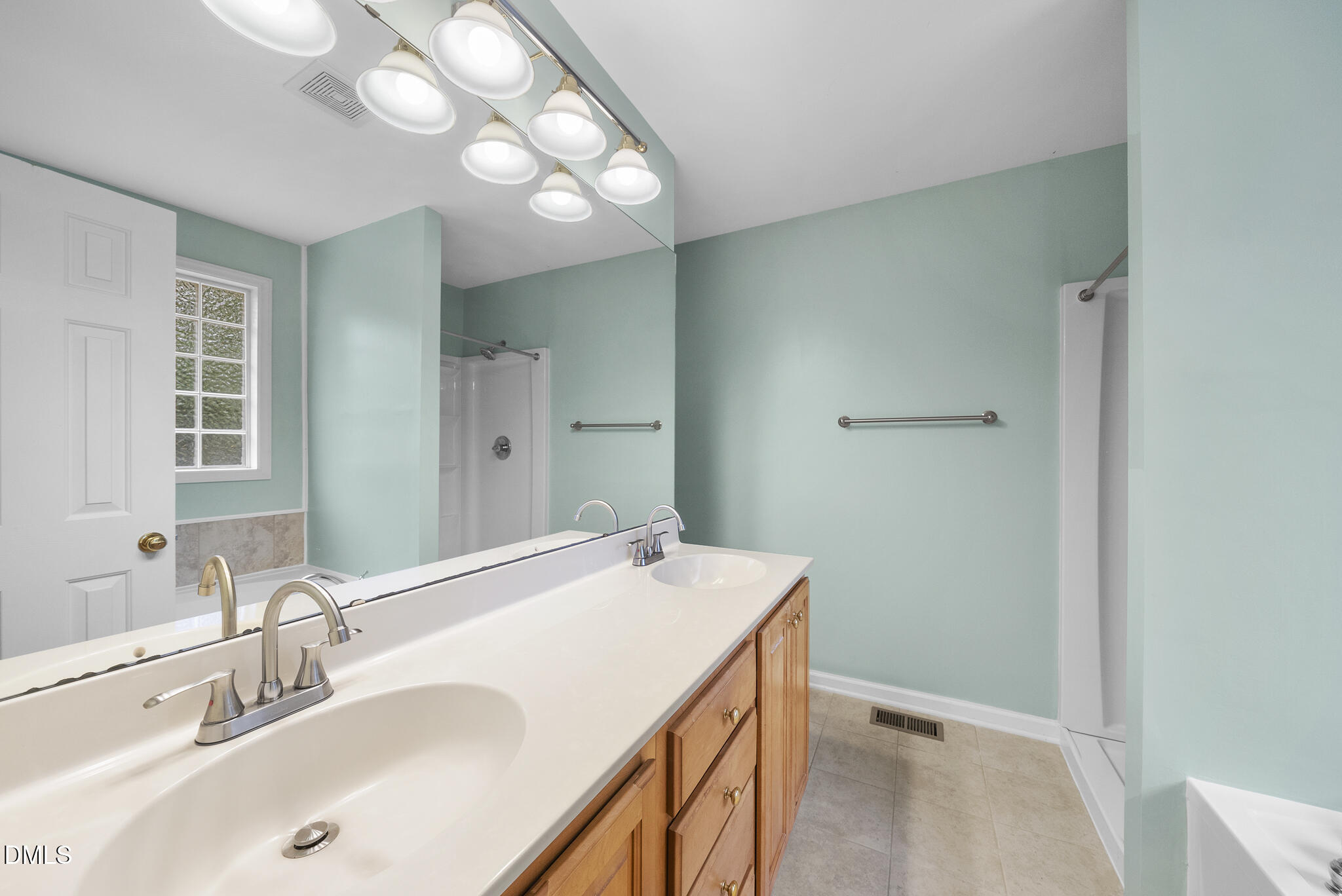 6 Stone Mill Place Durham, NC 27712 - Photo 20 of 44 a bathroom with a sink and a mirror