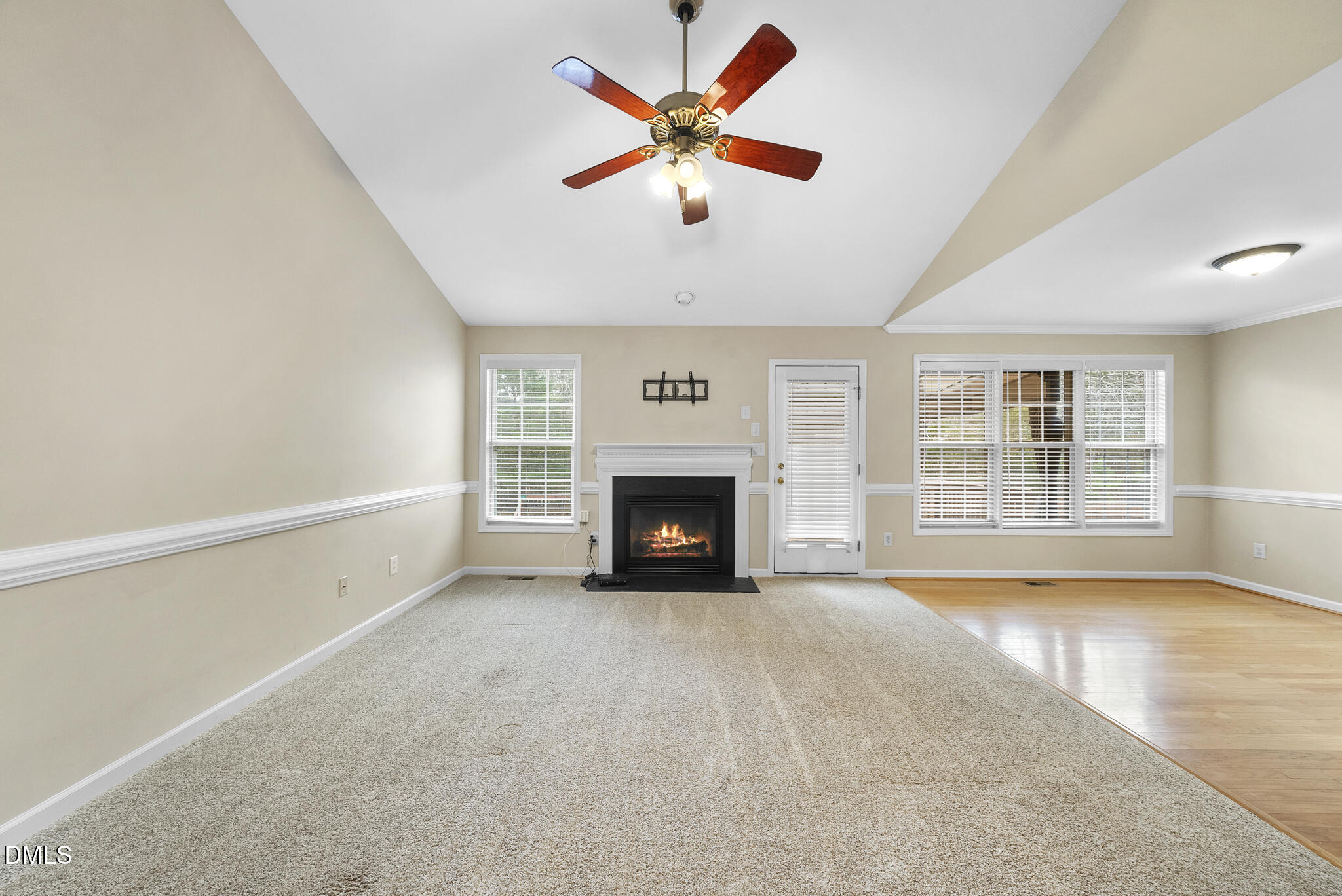 6 Stone Mill Place Durham, NC 27712 - Photo 5 of 44 a view of an empty room with window and a fireplace