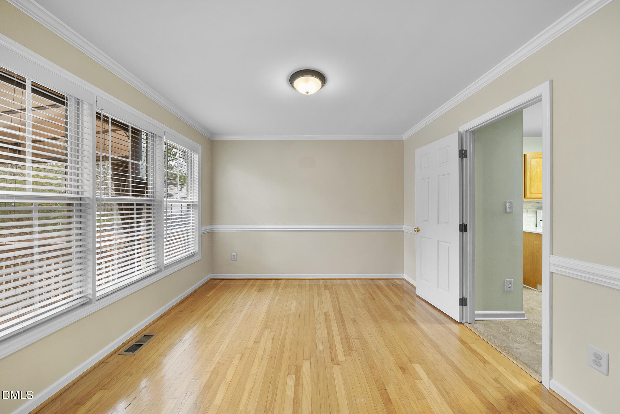 6 Stone Mill Place Durham, NC 27712 - Photo 9 of 44 a view of a room with wooden floor and windows