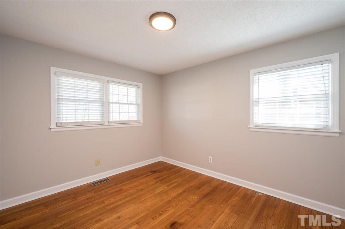 3814 Woodside Road Garner, NC 27529 - Photo 22 of 28 a view of a room with wooden floor and windows