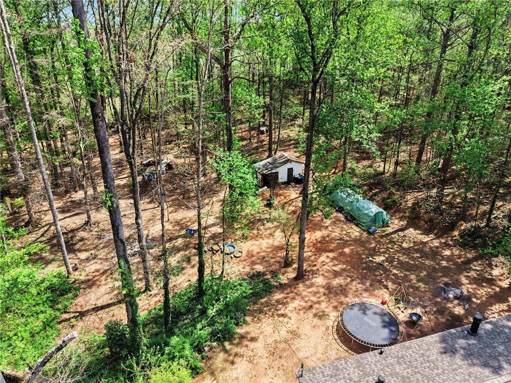 90 Birch Court Jefferson, GA 30549 - Photo 1 of 5 a backyard of a house with lots of green space