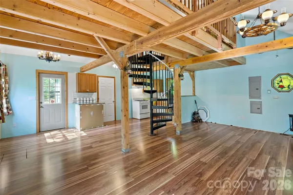 a kitchen with a sink a stove and cabinets