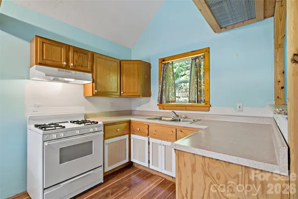 a view of a bathroom with a sink and a window
