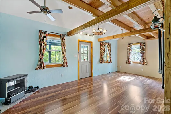 a view of entryway with wooden floor