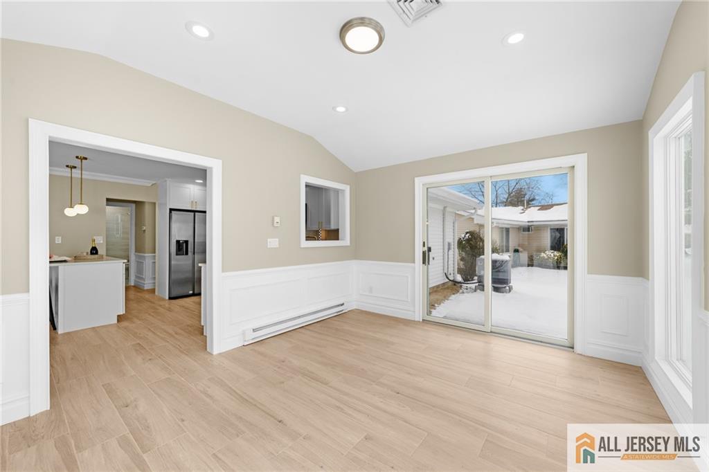 747 Marlton Road, Unit 747A Monroe Township, NJ 08831 - Photo 12 of 30 a view of a livingroom with wooden furniture and windows
