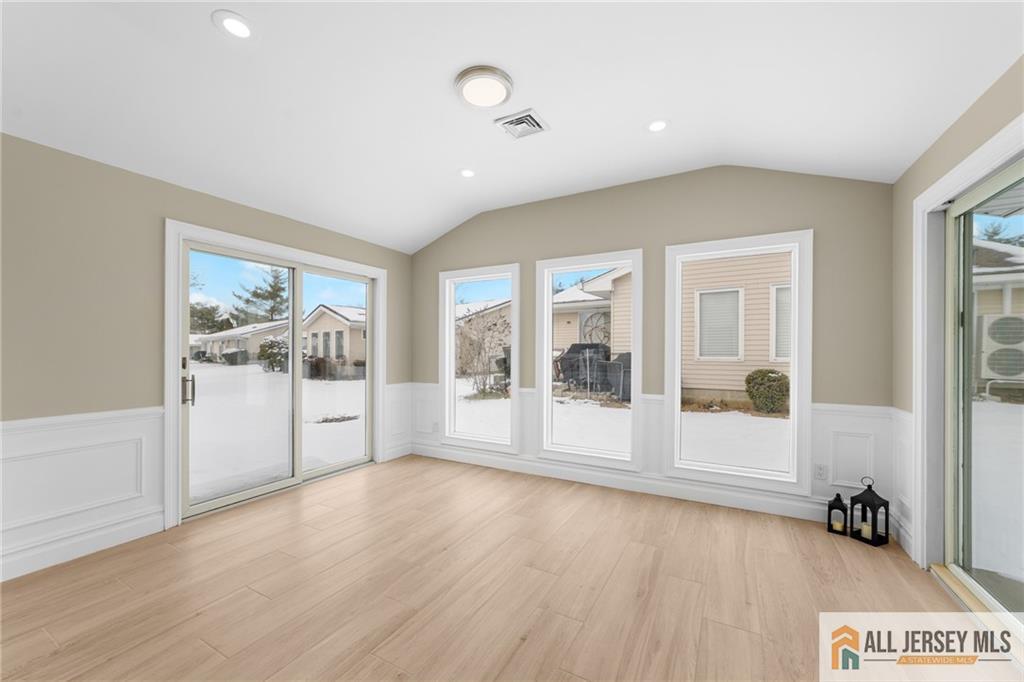 747 Marlton Road, Unit 747A Monroe Township, NJ 08831 - Photo 13 of 30 a view of a big room with wooden floor and windows