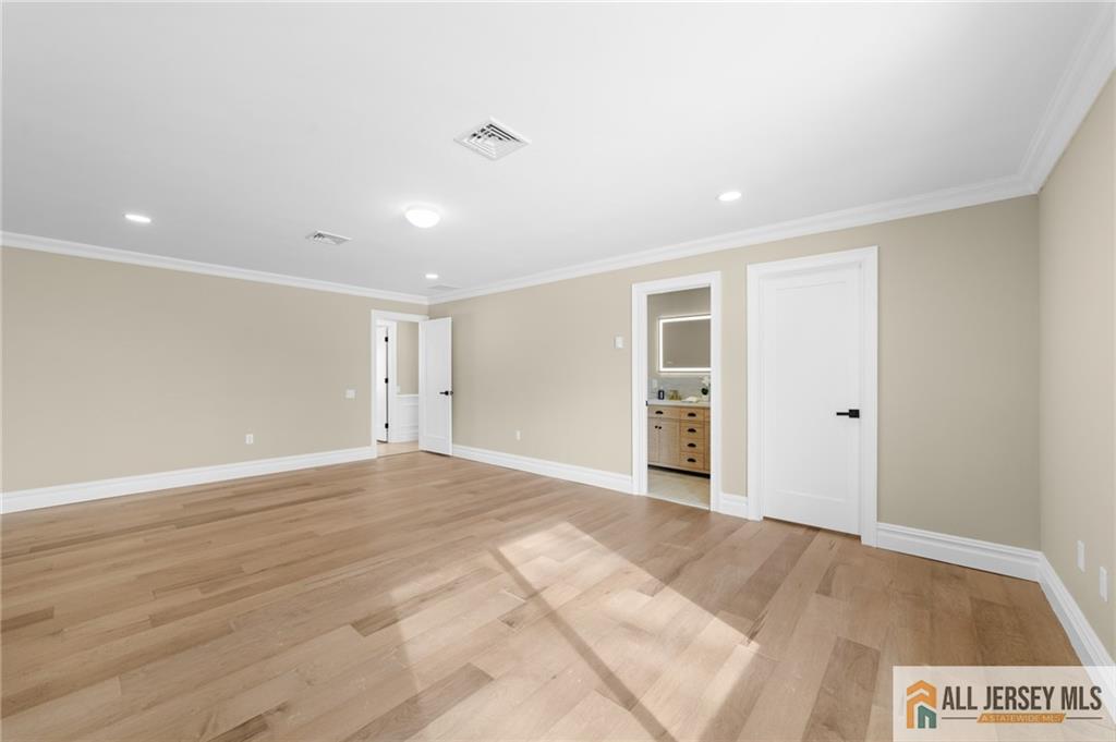 747 Marlton Road, Unit 747A Monroe Township, NJ 08831 - Photo 20 of 30 a view of an empty room with wooden floor and closet