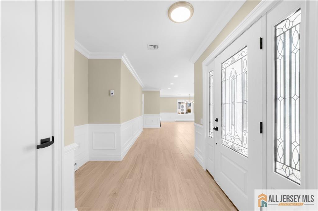 747 Marlton Road, Unit 747A Monroe Township, NJ 08831 - Photo 4 of 30 a view of a hallway with wooden floor and windows