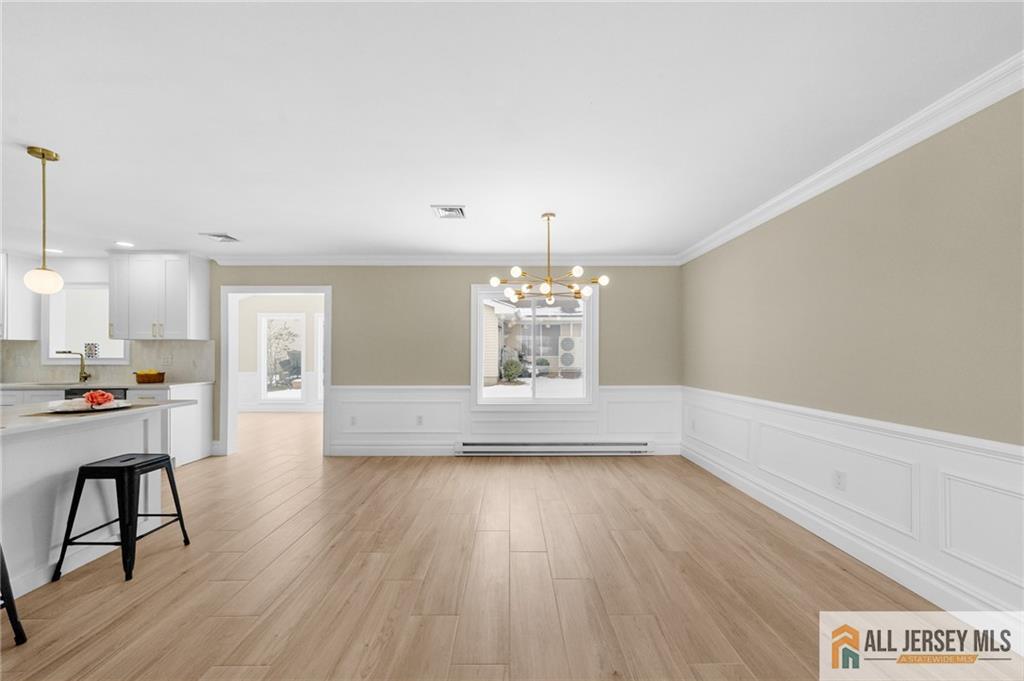 747 Marlton Road, Unit 747A Monroe Township, NJ 08831 - Photo 5 of 30 a view of a room with wooden floor and windows