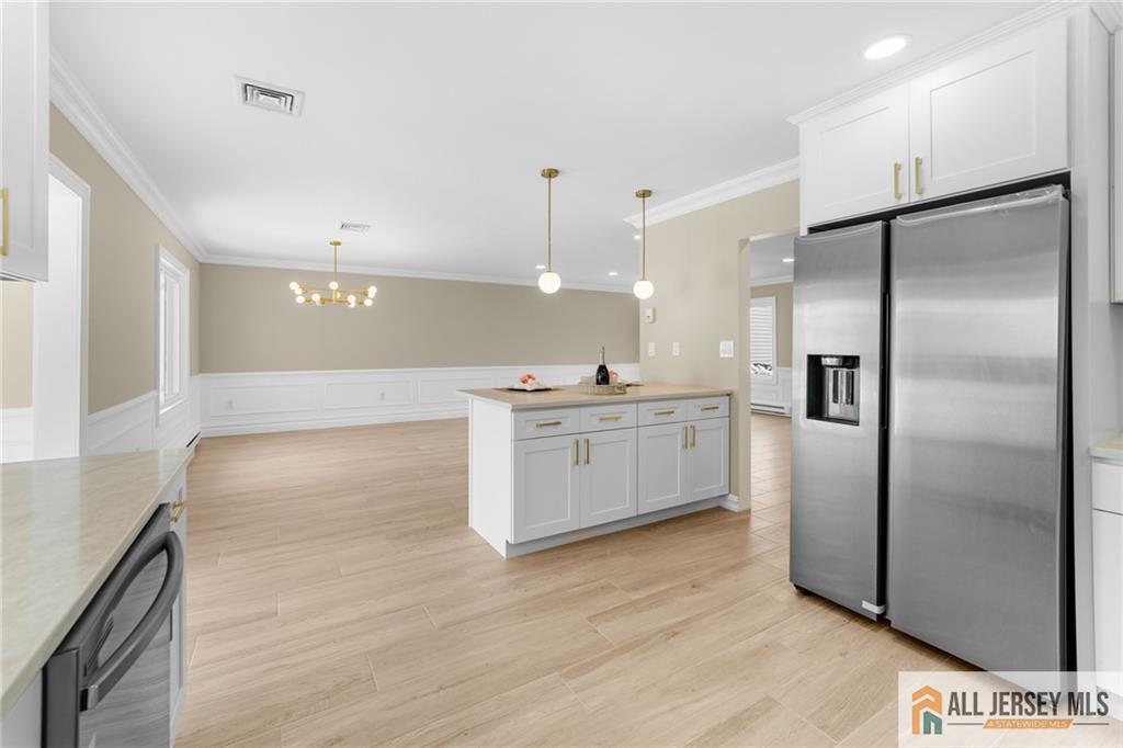 747 Marlton Road, Unit 747A Monroe Township, NJ 08831 - Photo 10 of 30 a kitchen with stainless steel appliances a refrigerator and a sink