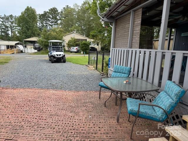 109 Hide-A-Way Trail Mount Gilead, NC 27306 - Photo 14 of 15 a view of a chair and table in backyard of the house