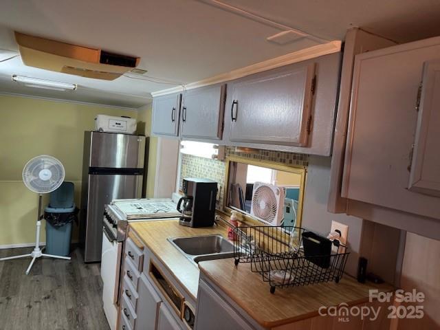 109 Hide-A-Way Trail Mount Gilead, NC 27306 - Photo 7 of 15 a kitchen with stainless steel appliances granite countertop a sink and a refrigerator