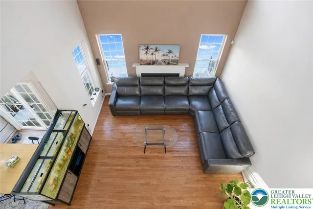 a living room with furniture and a rug