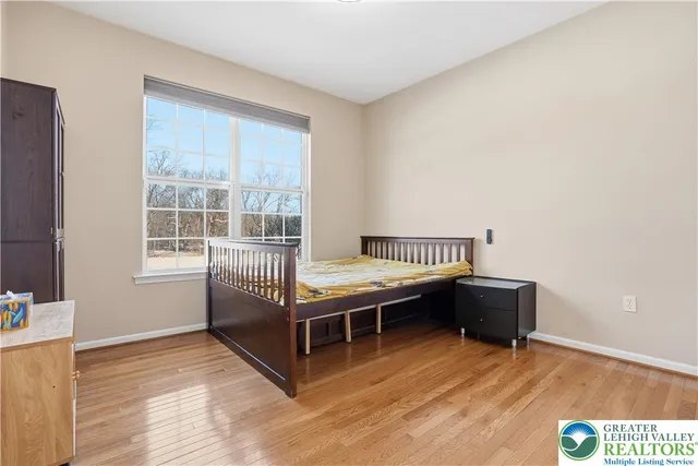 a room with a bed and a window