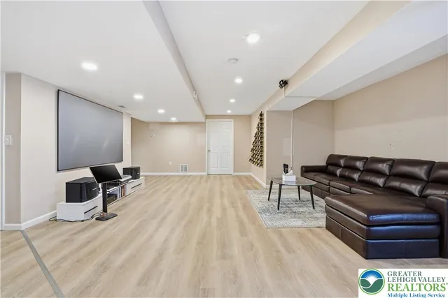 a projector room with a couch and a table