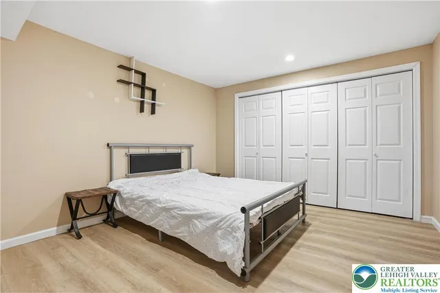 a bedroom with a bed and a dresser