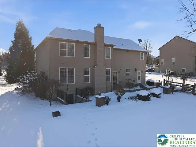 a view of a house with a bench