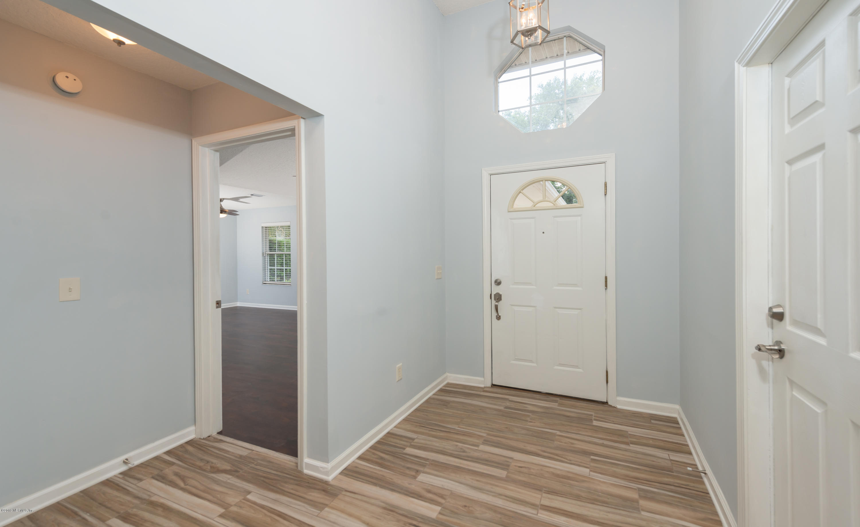 107 Mohegan Road St. Augustine, FL 32086 - Photo 2 of 38 a view of a hallway to a closet and wooden floor
