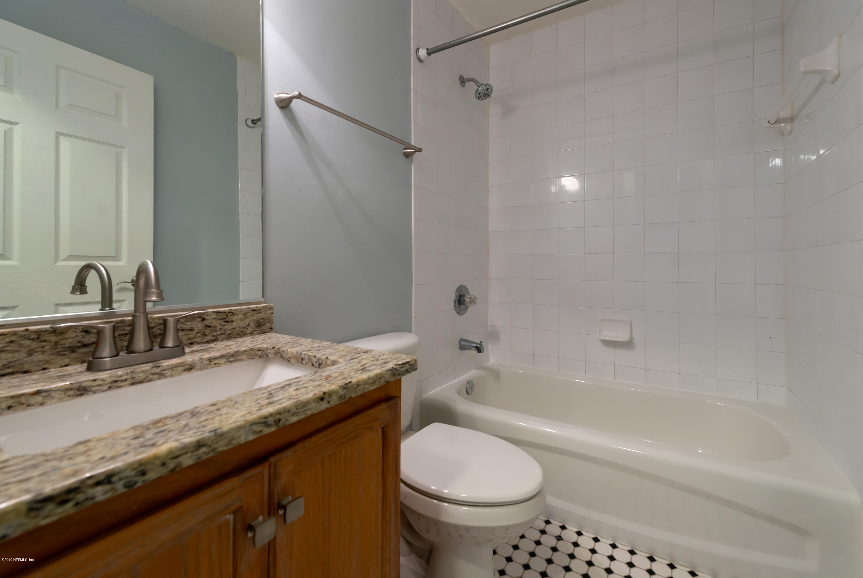 107 Mohegan Road St. Augustine, FL 32086 - Photo 27 of 38 a bathroom with a granite countertop sink toilet and shower