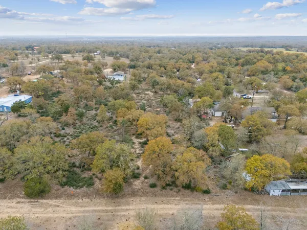 an aerial view of house with yard