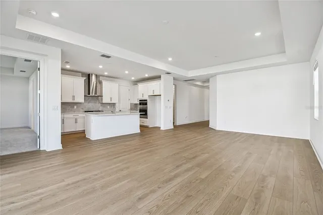 a view of kitchen with wooden floor