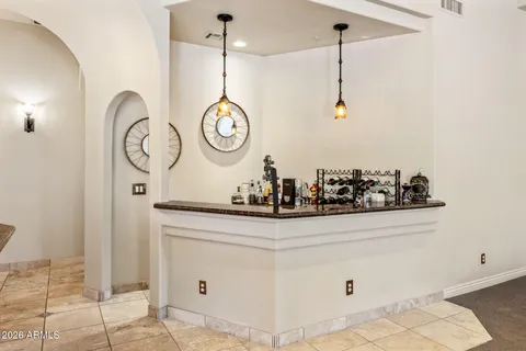 a view of a hallway with washer dryer and white walls