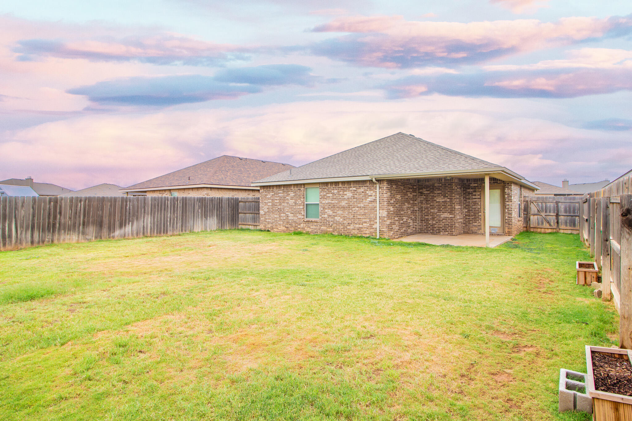 7409 101st Street Lubbock, TX 79424 - Photo 20 of 22 a front view of a house with a swimming pool