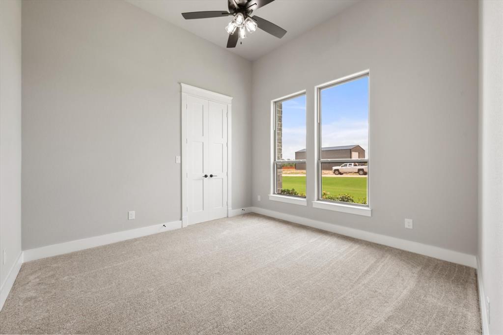 6610 Waggoner Way Midlothian, TX 76065 - Photo 34 of 40 Room with vaulted ceiling and light gray walls