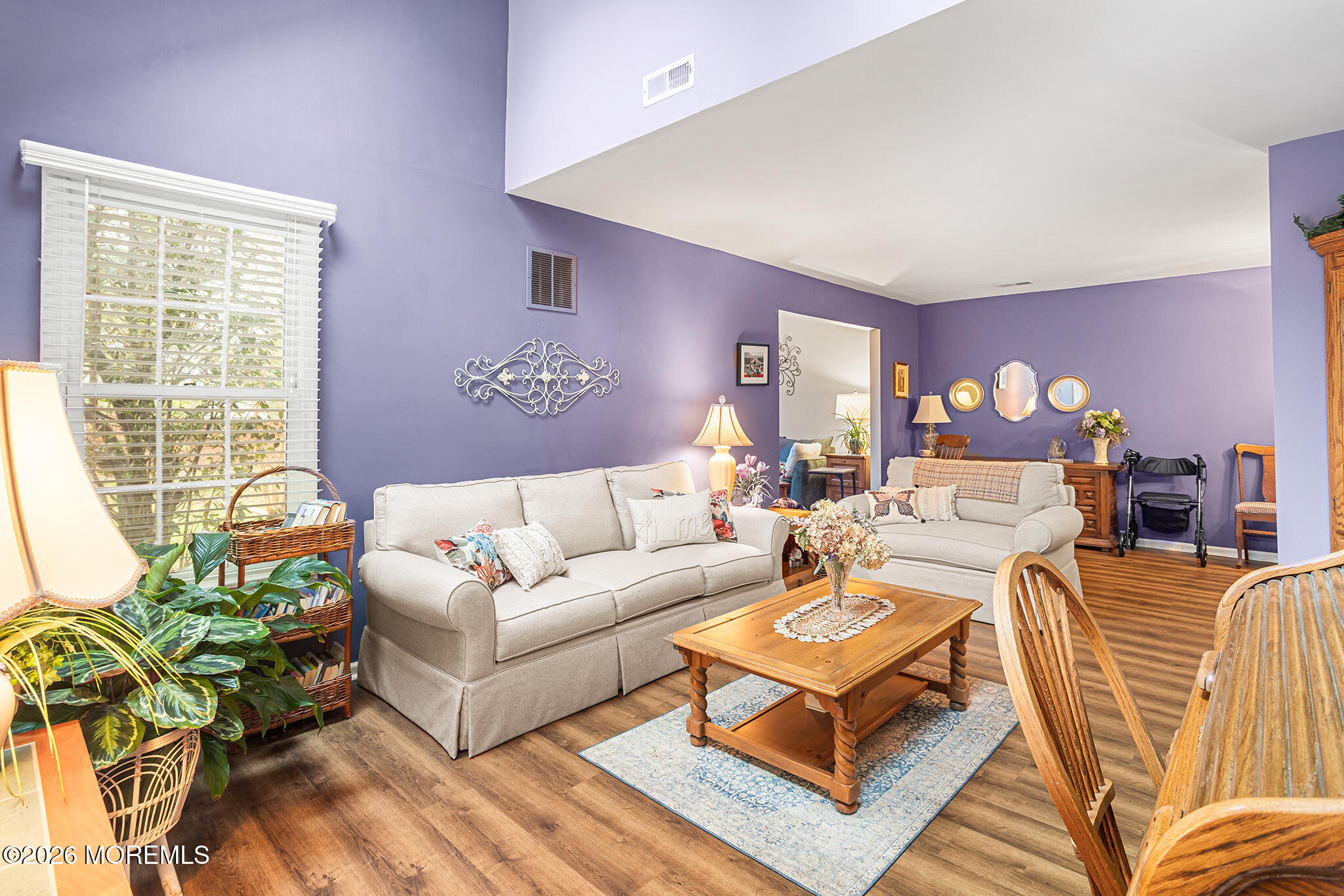 11 Browning Court Freehold, NJ 07728 - Photo 1 of 34 a living room with furniture a lamp and a potted plant
