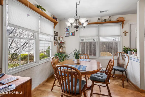 a view of a dining room with furniture window and outside view