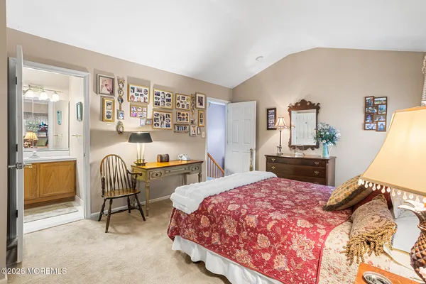 a bedroom with a bed and a chair