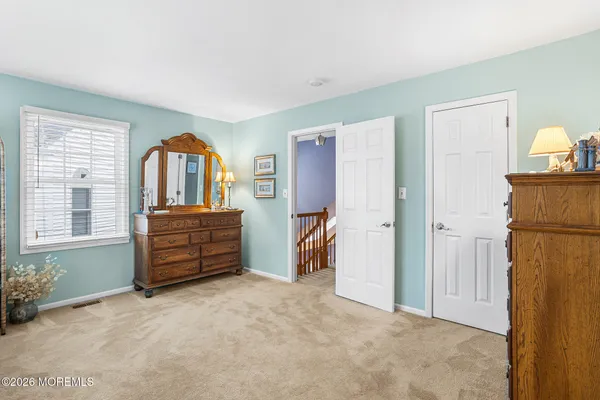 a room with a bed and a window