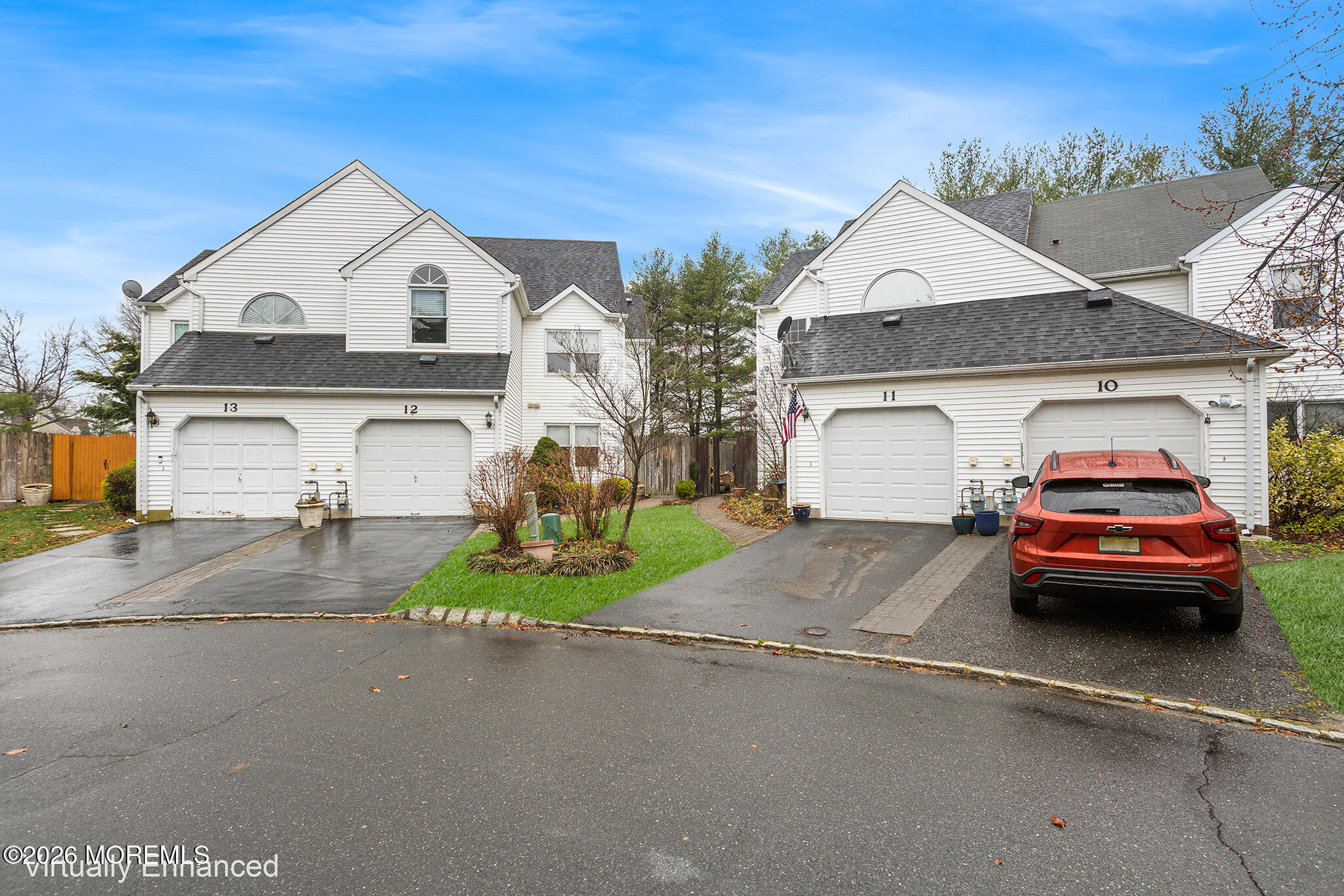 11 Browning Court Freehold, NJ 07728 - Photo 33 of 34 a view of a car parked in front of a house