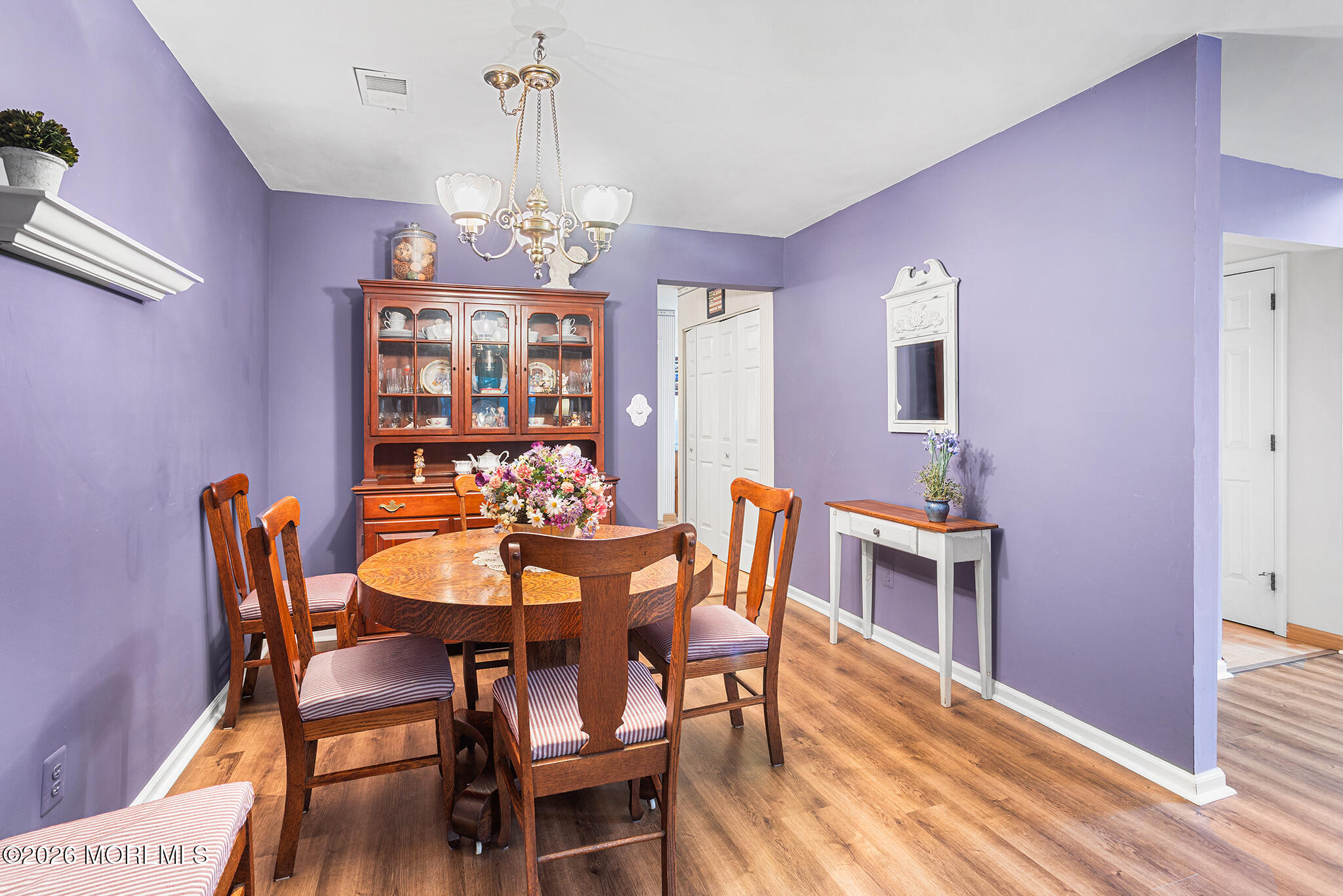 11 Browning Court Freehold, NJ 07728 - Photo 4 of 34 a view of a dining room with furniture window and wooden floor