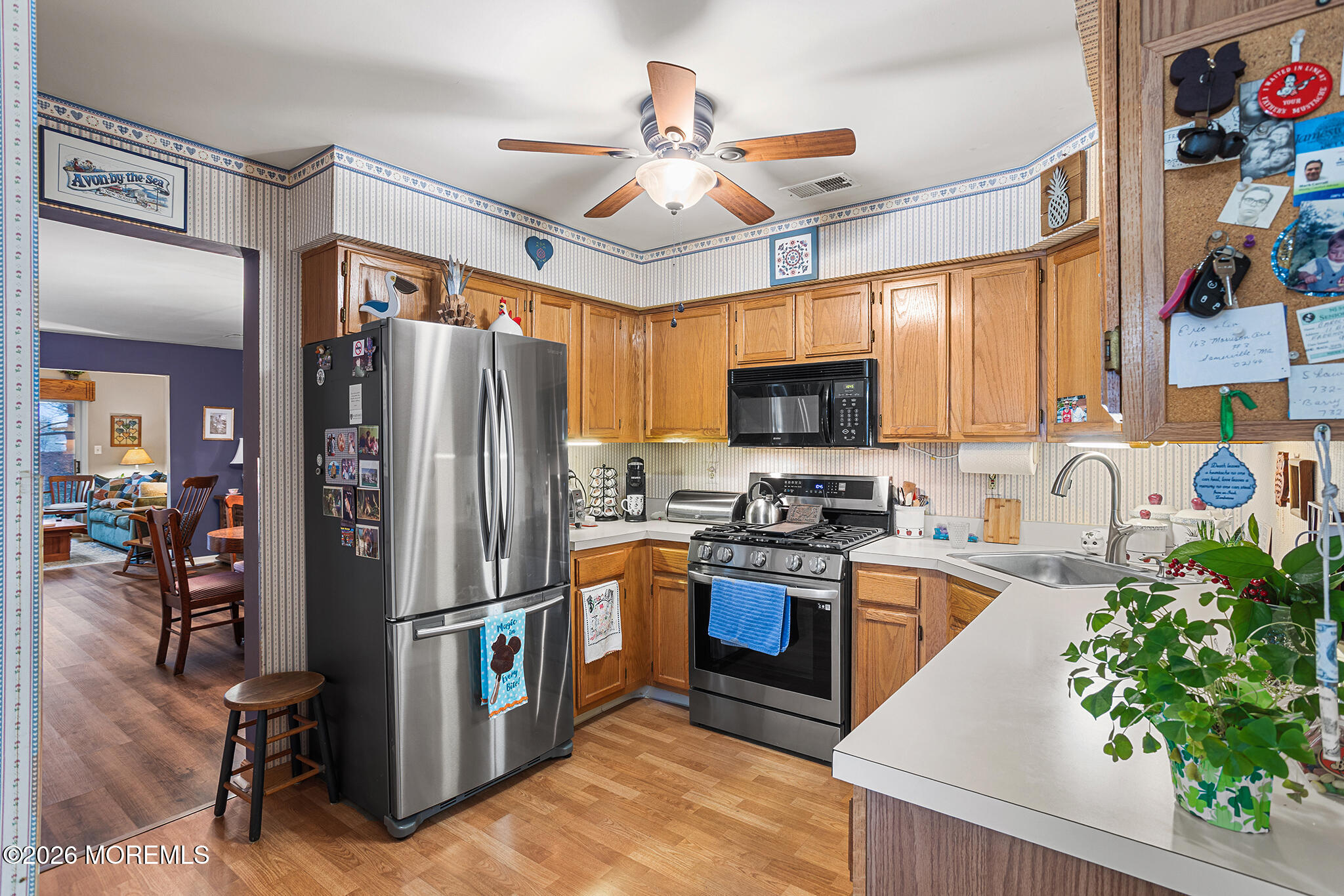 11 Browning Court Freehold, NJ 07728 - Photo 9 of 34 a kitchen with stainless steel appliances granite countertop a refrigerator a stove top oven a sink and dishwasher