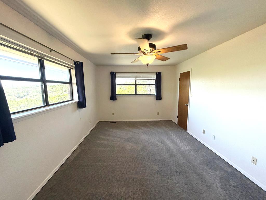 707 Rimrock Road Kerrville, TX 78028 - Photo 33 of 55 a view of an empty room with a window