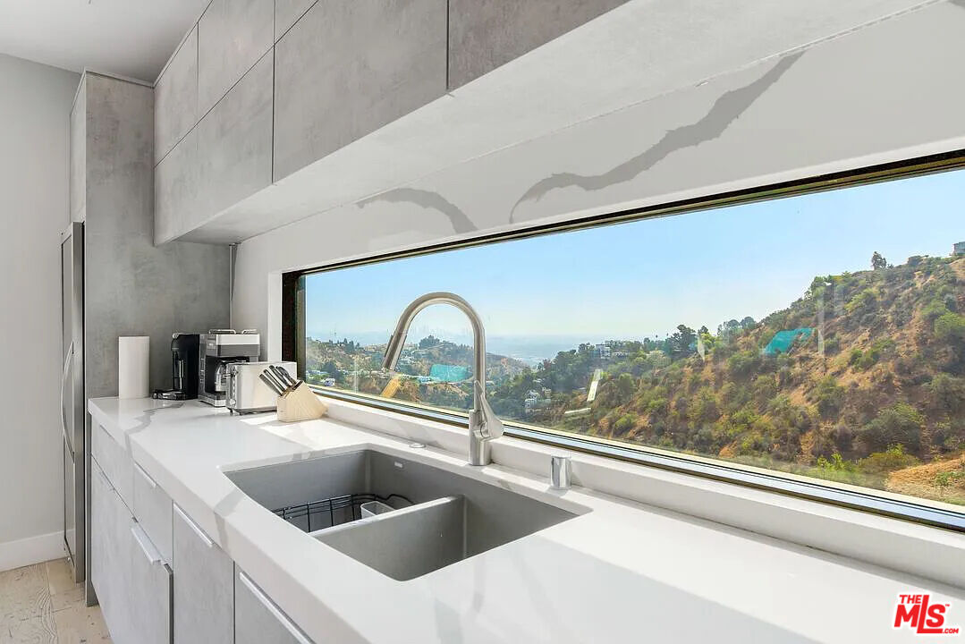 8401 Wyndham Road Los Angeles, CA 90046 - Photo 11 of 34 a kitchen with a sink and a large window