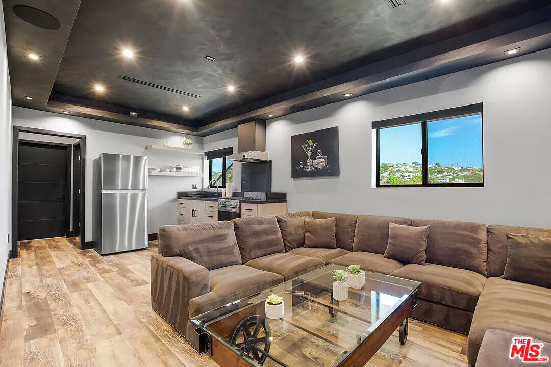 8401 Wyndham Road Los Angeles, CA 90046 - Photo 17 of 34 a view of a livingroom with furniture and a wooden floor