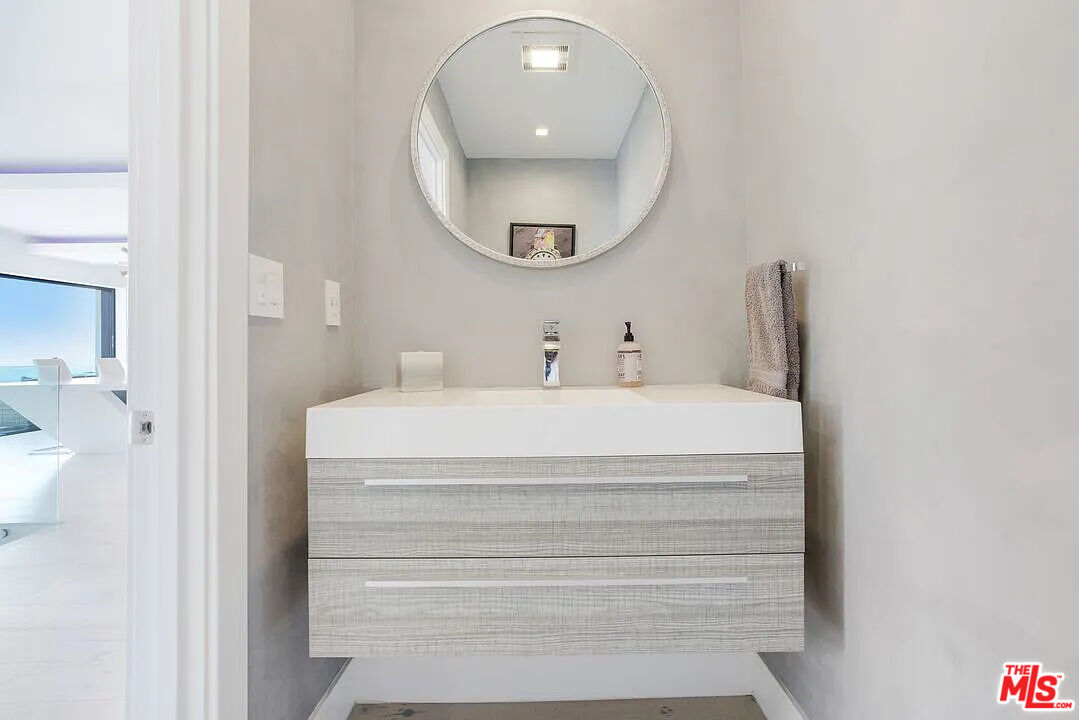 8401 Wyndham Road Los Angeles, CA 90046 - Photo 18 of 34 a bathroom with a sink and a mirror