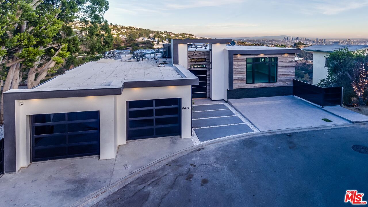 8401 Wyndham Road Los Angeles, CA 90046 - Photo 19 of 34 an outdoor view of house and garage