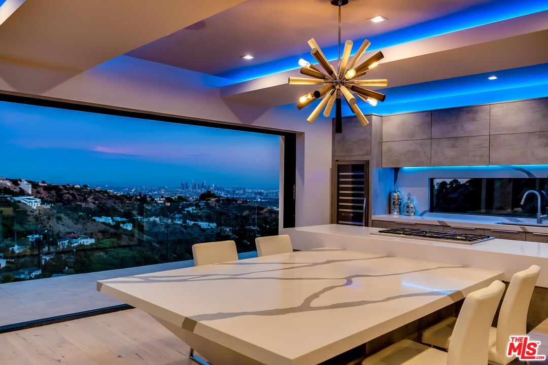 8401 Wyndham Road Los Angeles, CA 90046 - Photo 20 of 34 a view of a patio with a table and chairs