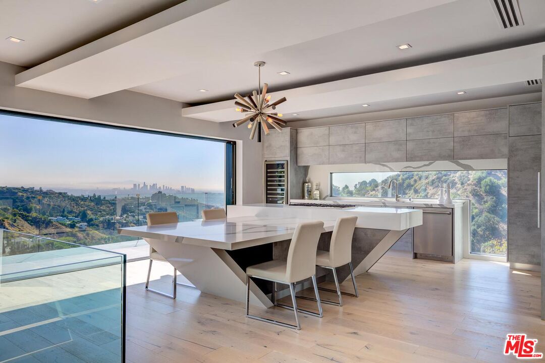8401 Wyndham Road Los Angeles, CA 90046 - Photo 23 of 34 a dining room with furniture and window