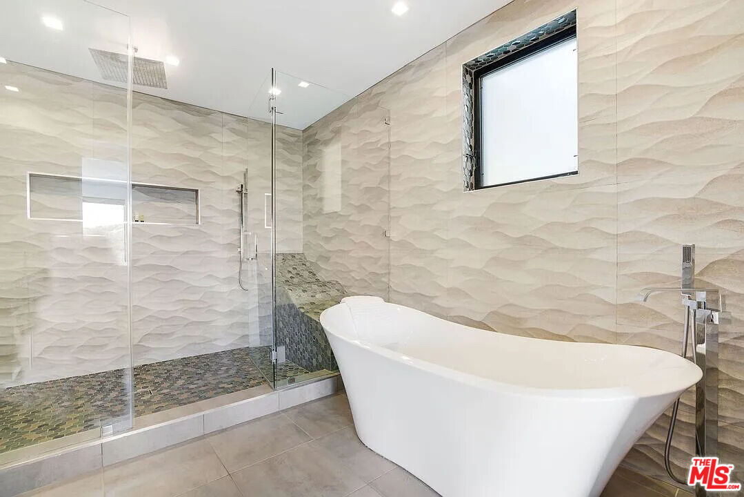 8401 Wyndham Road Los Angeles, CA 90046 - Photo 31 of 34 a bathroom with a bathtub and shower