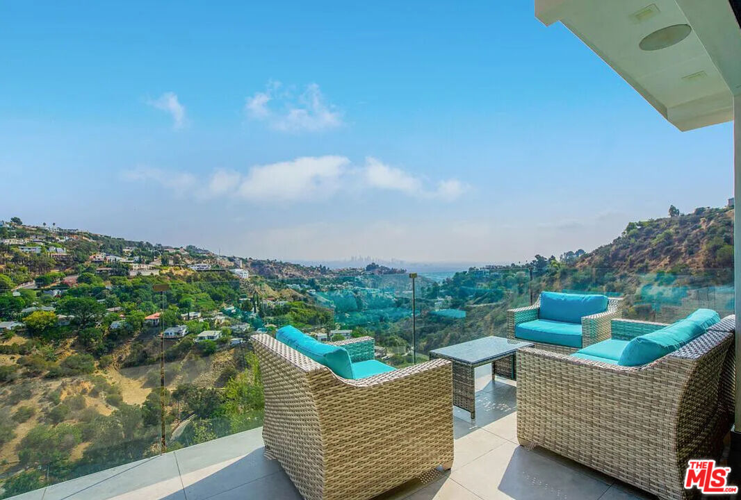 8401 Wyndham Road Los Angeles, CA 90046 - Photo 7 of 34 a view of a couches in a balcony