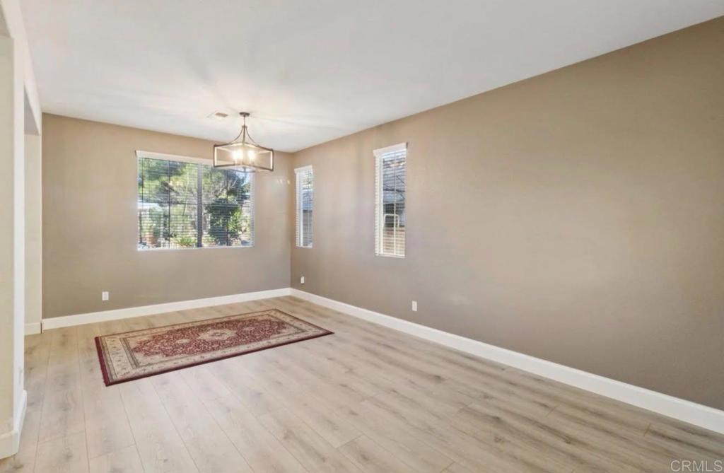 1234 Old Janal Ranch Road Chula Vista, CA 91915 - Photo 13 of 34 an empty room with windows