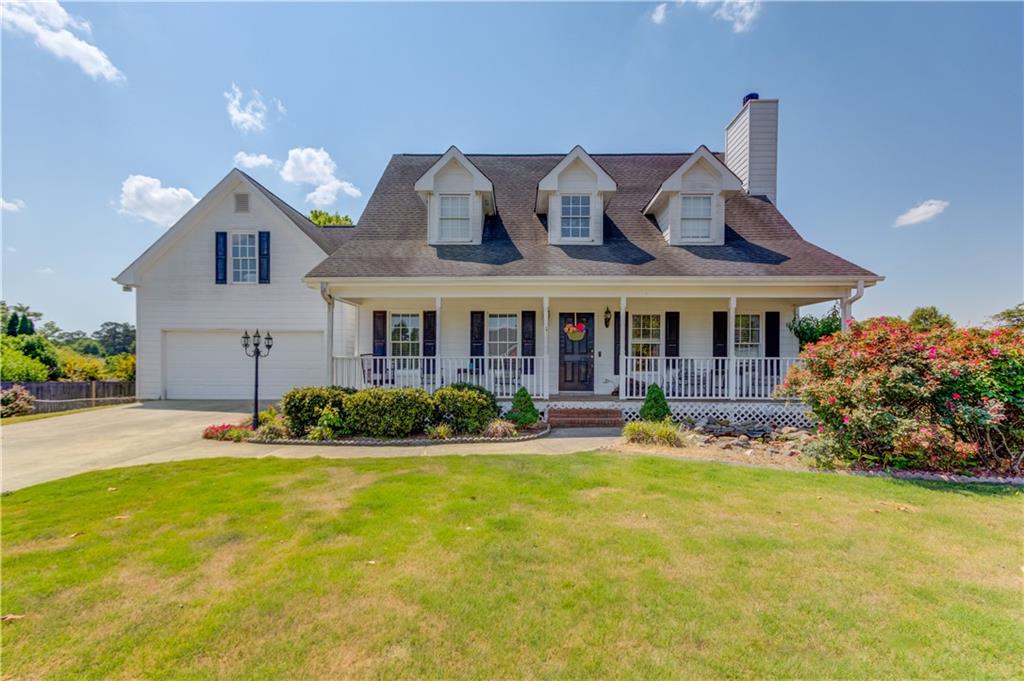 204 Angie Way Bethlehem, GA 30620 - Photo 1 of 42 a front view of house with yard outdoor seating and barbeque oven