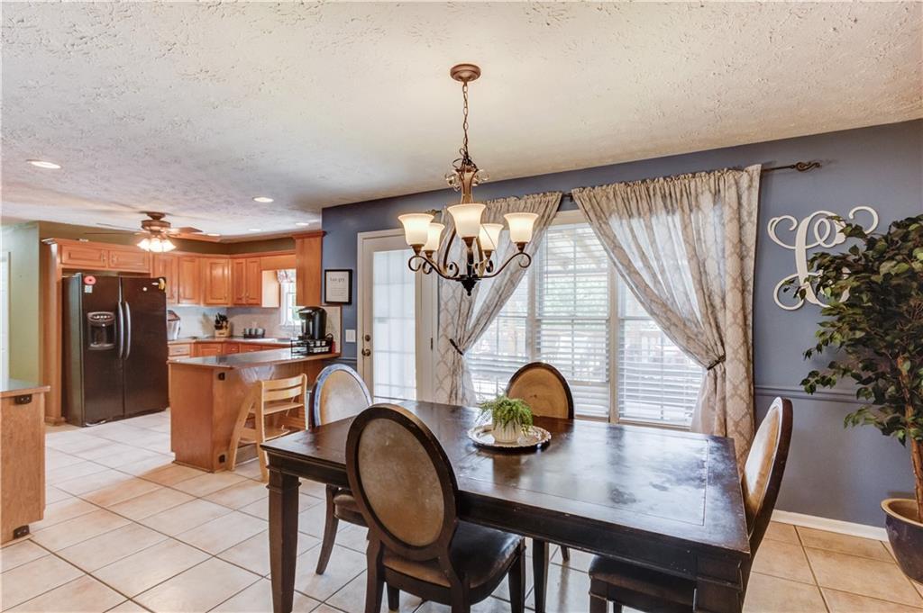 204 Angie Way Bethlehem, GA 30620 - Photo 11 of 42 a dining room with furniture and window