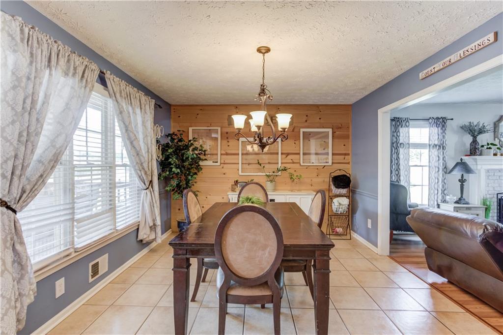 204 Angie Way Bethlehem, GA 30620 - Photo 12 of 42 a view of a dining room with furniture window and outside view
