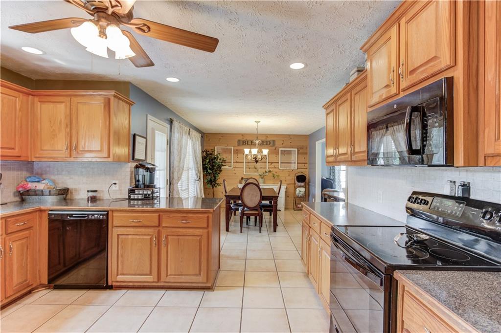 204 Angie Way Bethlehem, GA 30620 - Photo 16 of 42 a kitchen with stainless steel appliances granite countertop a stove and a sink