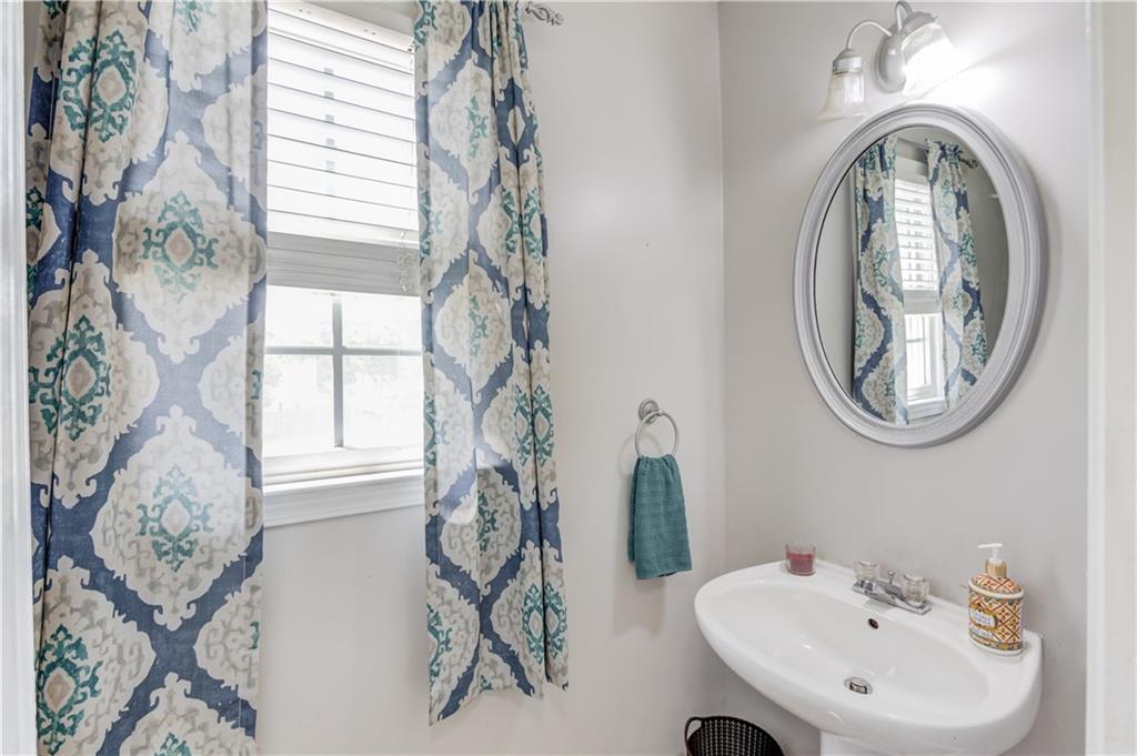 204 Angie Way Bethlehem, GA 30620 - Photo 17 of 42 a bathroom with a sink and a mirror
